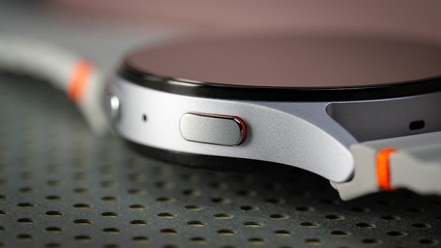 A close-up of a Samsung Galaxy Watch 7 showing its side button and sleek design.