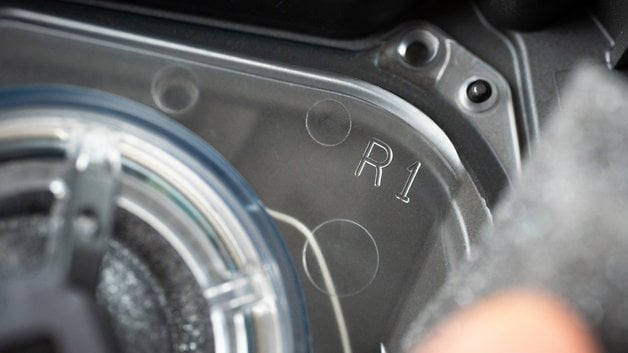 Close-up of the interior of the Sony WH-1000XM6 headphones, showing the engraving and components.