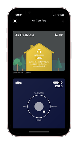 Un écran de smartphone affichant des informations sur la qualité de l'air et les niveaux d'humidité.