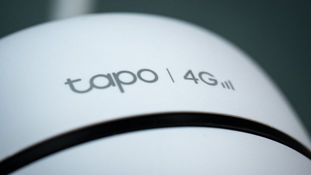 Close up of a device with the 'tapo' logo and '4G' on a white surface.