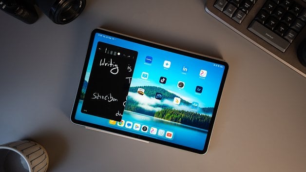 Xiaomi Pad 7 shows a note with 'Writing is' against a picturesque background with various apps.