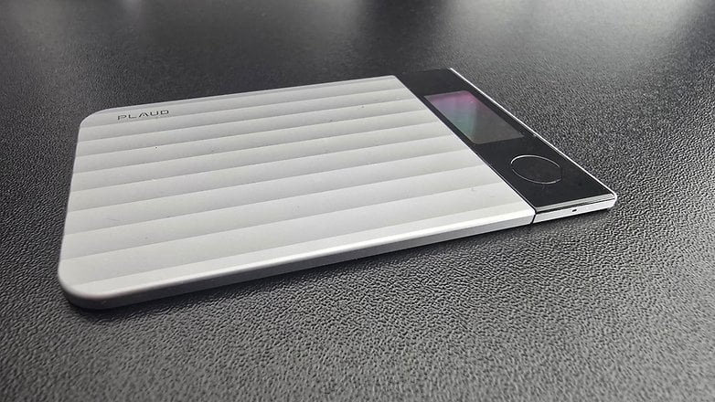 A sleek silver digital notebook with ridged design and minimalistic interface.