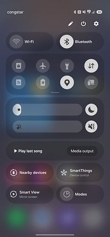 Samsung One UI 7.0 quick settings menu with Wi-Fi, Bluetooth, and device control options.