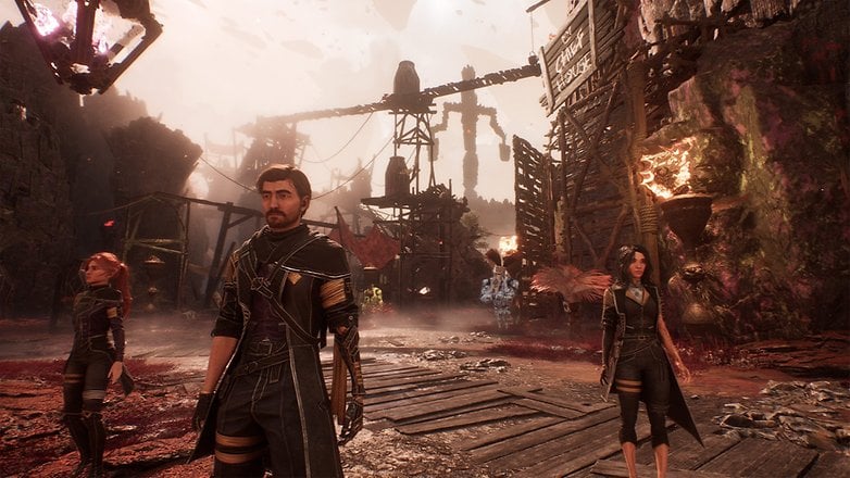 Drei Charaktere in einer dystopischen Landschaft aus dem Videospiel 'Clair Obscur: Expedition 33'.
