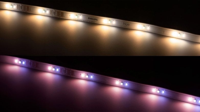 Philips Hue Lichtleiste mit warmen und farbigen Lichtern auf dunklem Hintergrund. Philips Hue Lichtleiste mit warmen und farbigen Lichtern auf dunklem Hintergrund.