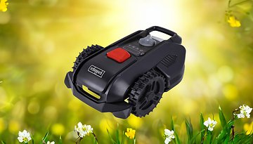 Ein Scheppach-Roboter-Rasenmäher vor einem hellen, blumigen Hintergrund.