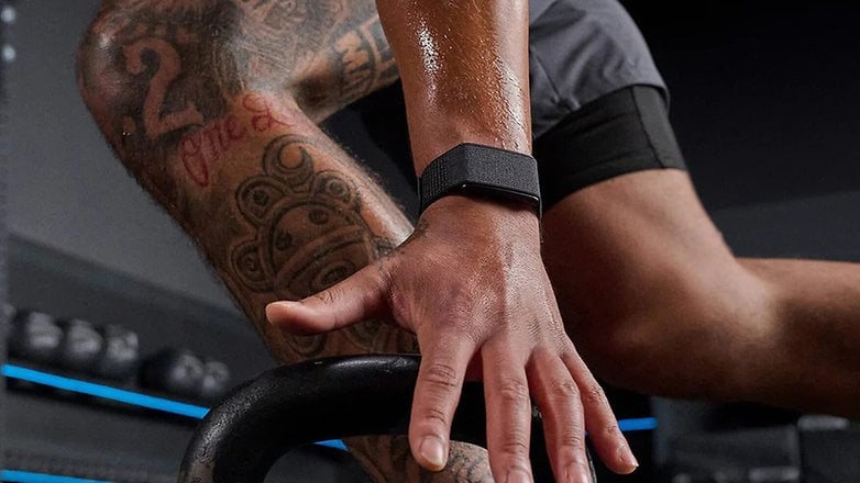 A close-up of a hand gripping a kettlebell, showcasing an Amazfit smartwatch on the wrist. A close-up of a hand gripping a kettlebell, showcasing an Amazfit smartwatch on the wrist.