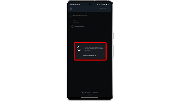 Android phone screen displaying a Wi-Fi hotspot setup with a loading message and connect manually option.