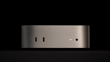 Apple Mac Mini M4 2024 viewed from the side, featuring two ports and a minimalist design.
