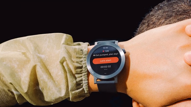 A close-up of a smartwatch displaying heart rate and a timer, worn on a wrist. A close-up of a smartwatch displaying heart rate and a timer, worn on a wrist.