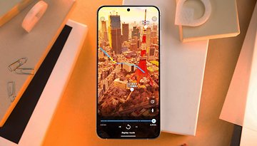 A smartphone displaying a Google Maps route over a cityscape.