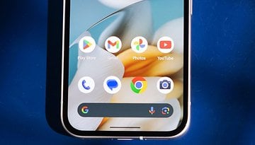 Close-up of a smartphone home screen displaying Google apps and icons.