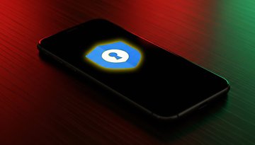 A smartphone displays the Google Password Manager logo on a dark background.