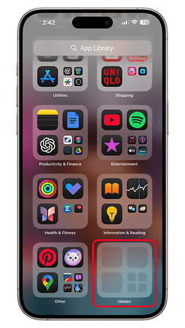 iPhone displaying the App Library in iOS 18 with various app folders and a highlighted 'Hidden' folder.