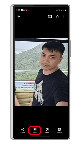 A person taking a selfie in a cable car with mountains in the background and an 'Edit' button highlighted.