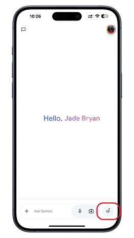 A smartphone screen displaying 'Hello, Jade Bryan' and options to interact with 'Ask Gemini'.