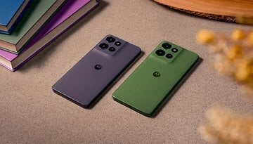 Two Motorola Moto G Power 2025 smartphones in gray and green on a textured surface with books in the background.