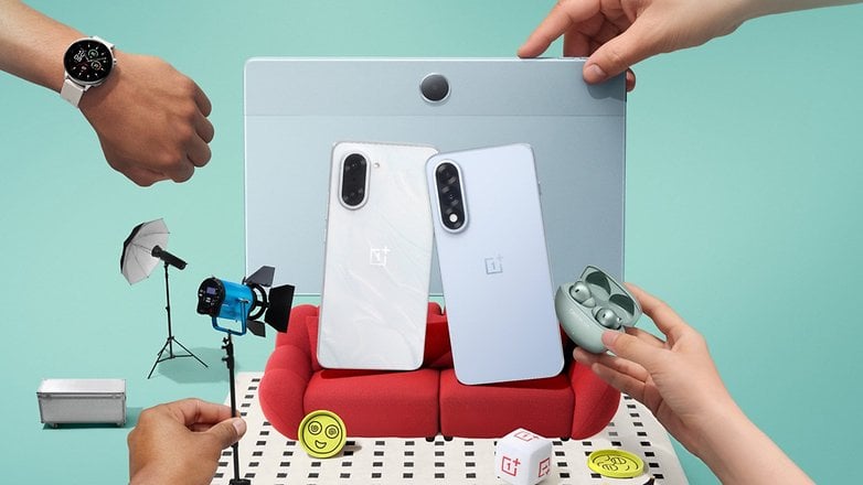 A OnePlus Watch 3 on a wrist, surrounded by a phone, earbuds, and photography equipment. A OnePlus Watch 3 on a wrist, surrounded by a phone, earbuds, and photography equipment.
