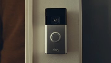 A Ring video doorbell mounted on a wall.