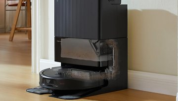 Roborock robotic vacuum cleaner with a docking station, designed for automatic cleaning and dirt disposal.