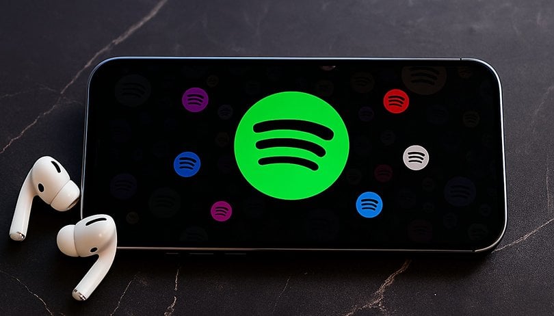 Something’s Different About Spotify—And Free Users Are Loving It Spotify Android phone with AirPods free premium feature