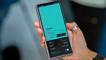 A person holding a Samsung Galaxy Z Fold 5 displaying a VPN connection screen.