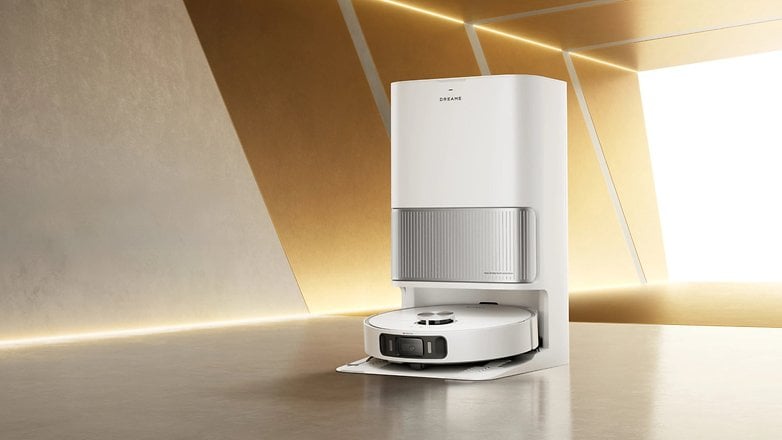 Dreame L40 Ultra AE robotic vacuum cleaner with a sleek white design and base station. Dreame L40 Ultra AE robotic vacuum cleaner with a sleek white design and base station.