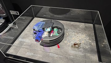 Display of the Dyson Spot+Scrub Ai, showcasing its internal components and cleaning capabilities.
