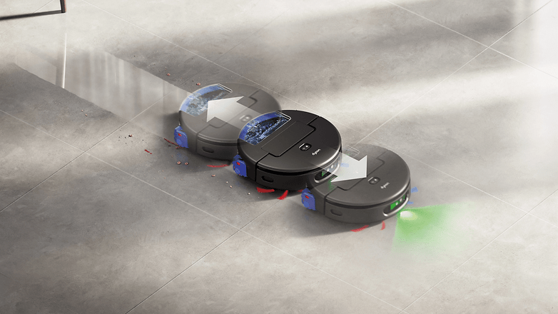 Three Dyson Spot+Scrub Ai robots cleaning a tiled floor with debris visible.