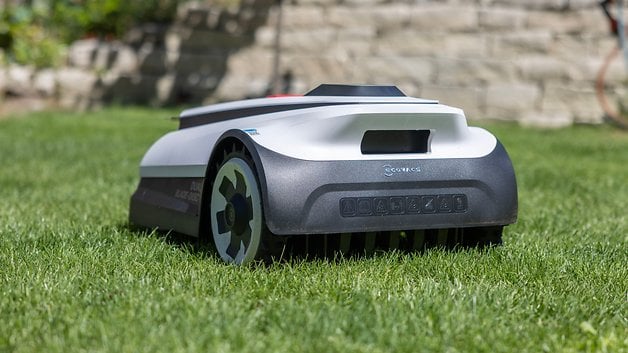 Ecovacs Goat A1600 RTK robotic lawn mower performing its duty on green grass.
