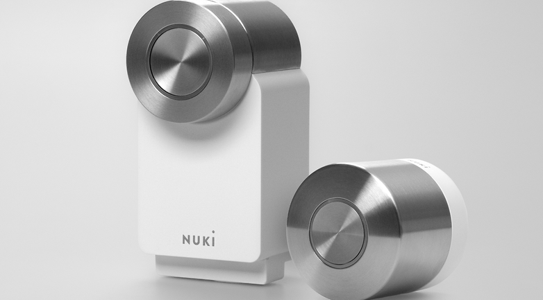 Nuki Smart Lock Ultra in white and silver design, showcasing a modern smart lock system.