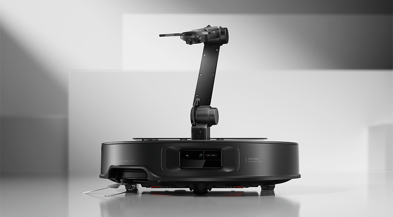 Roborock Saros Z70 robotic vacuum cleaner with a robotic arm, displayed on a minimalist background.