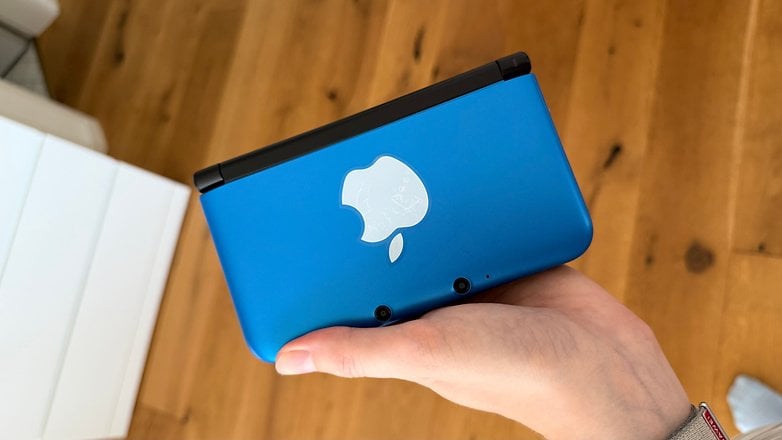 The outside of a Nintendo 3DS with a sticker.
