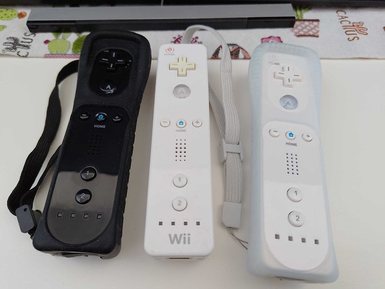 Three Wii remotes placed on a table