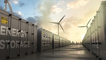 Batteriespeicher, Windräder, Sinnbild für Energieziele