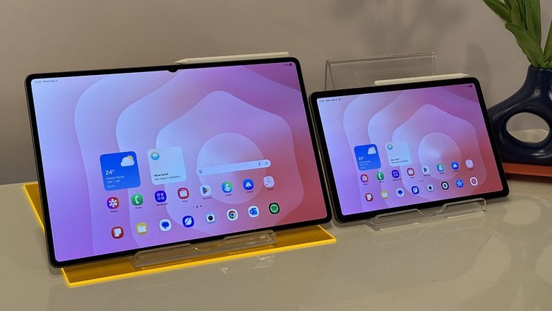 Two Samsung Galaxy Tab S11 tablets on stands, displaying a colorful home screen with various apps. Two Samsung Galaxy Tab S11 tablets on stands, displaying a colorful home screen with various apps.